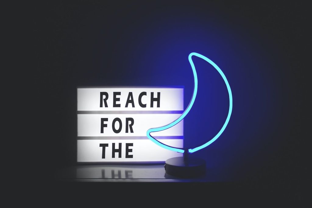 Reach for the and Blue Moon Neon Signages