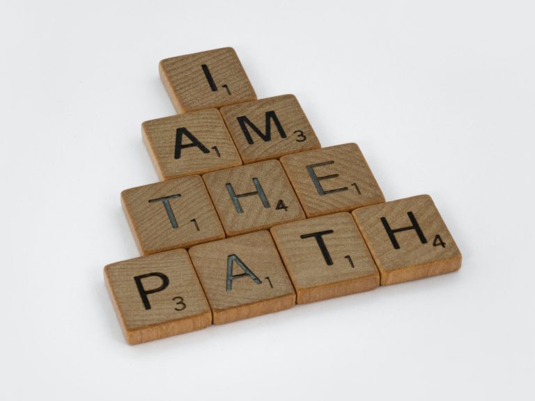 brown wooden letter blocks on white surface